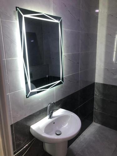 a bathroom with a sink and a mirror at Dream house hotel jerash in Jerash