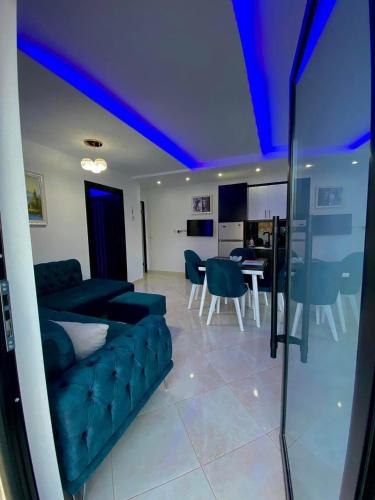 a living room with a couch and a table at ILLYRIAN Paradise in Ksamil