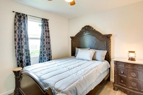 a bedroom with a large bed and a window at Thackerville Getaway with Porch - Near WinStar! in Thackerville