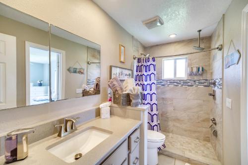 a bathroom with a sink and a shower at Waterfront Merritt Island Vacation Rental with Pool! in Merritt Island