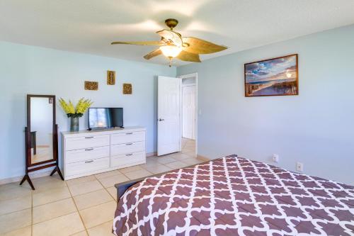 a bedroom with a bed and a ceiling fan at Waterfront Merritt Island Vacation Rental with Pool! in Merritt Island