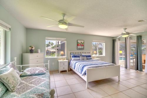 a bedroom with a bed and a couch at Waterfront Merritt Island Vacation Rental with Pool! in Merritt Island