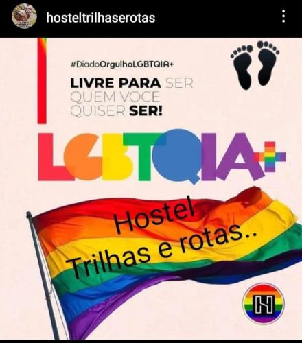 a poster for a luau with a rainbow flag at Hostel Trilhas e Rotas - a 150m da Avenida Paulista in Sao Paulo