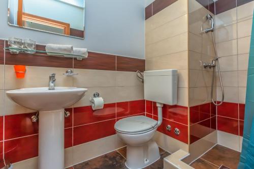 a bathroom with a toilet and a sink at Motel Ljetni raj in Baška Voda