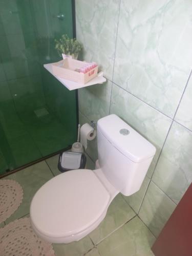 a bathroom with a white toilet in a room at Blau Haus in Pomerode