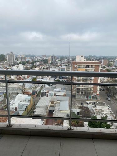 a view of a city from a balcony at Departamento con yacuzzi centrico in San Lorenzo