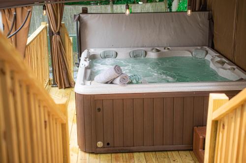 a jacuzzi tub in the middle of a house at Your Cozy and Relaxing Retreat in Woburn