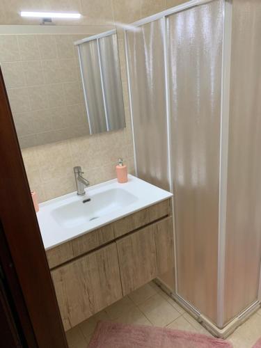 a bathroom with a shower and a white sink at Villa Franca on sea in Mazara del Vallo