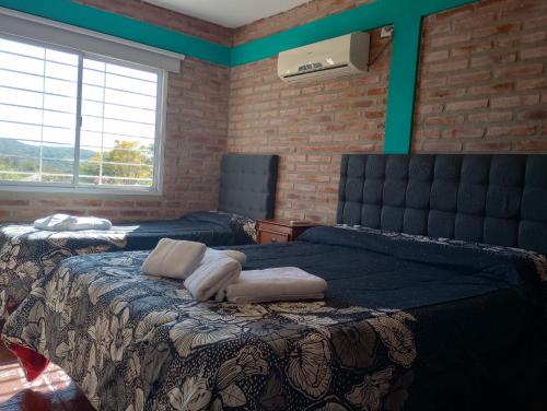 Tempat tidur dalam kamar di Terrazas de mayu