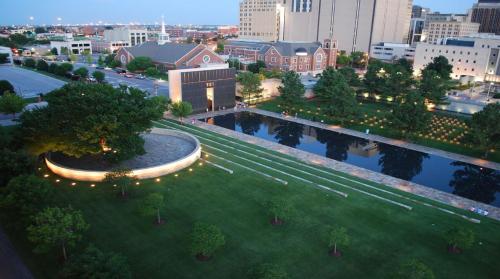 an overhead view of a park with trees and lights at Holiday Inn Express & Suites Moore by IHG in Moore
