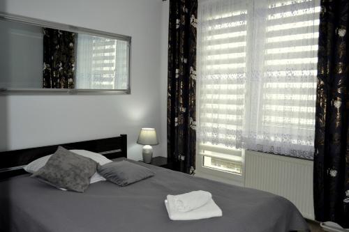 Ένα ή περισσότερα κρεβάτια σε δωμάτιο στο Hotel Piast