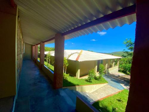 a view of a house from the outside of a window at Pousada Serra do Camulengo in Barra da Estiva