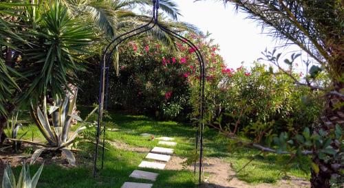 a garden with a swing in the grass at ANCIENT MEROPIA, Apollonia in Apollonia