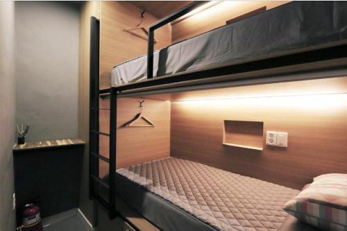a couple of bunk beds in a room at Blueboat Hostel Jeonju in Jeonju
