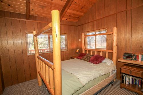 a bedroom with a bunk bed in a cabin at Rest N Relax Inn - Beautiful chalet-style cabin features dramatic forest and slope views! in Big Bear Lake
