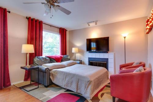 a bedroom with a bed and a tv and a fireplace at Heart of Downtown/Walk to BROADWAY & THE ACTION/BARS/Music Venues/Honky Tonks! in Nashville
