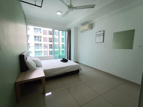 a white room with a bed and a window at Pacific Place Evolve Mall LRT Pool Parking Netflix Kitchen in Petaling Jaya