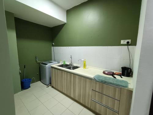 a small kitchen with a sink and a sink at Pacific Place Evolve Mall LRT Pool Parking Netflix Kitchen in Petaling Jaya