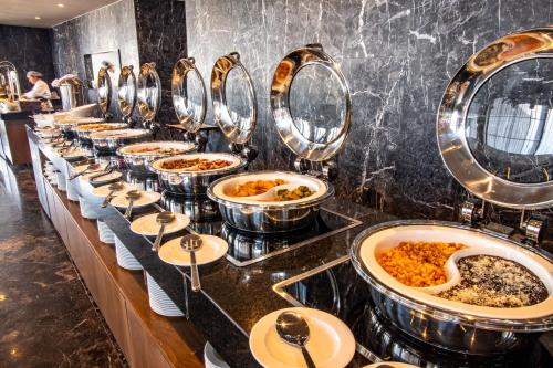 a row of buffet dishes in a restaurant at Fiesta Americana San Luis Potosi in San Luis Potosí