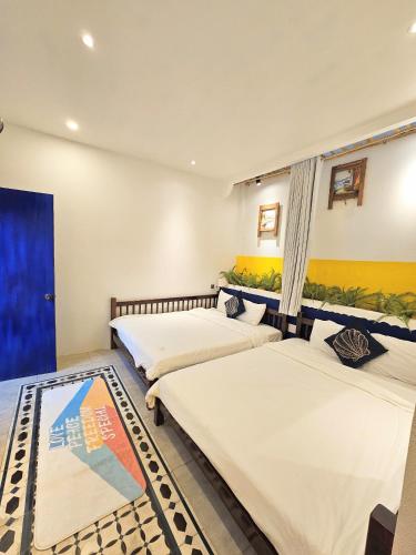 Ένα ή περισσότερα κρεβάτια σε δωμάτιο στο Hacoda Homestay