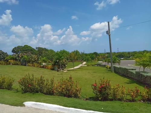 a park with a green field and a road at Ocean View Get Away in Falmouth