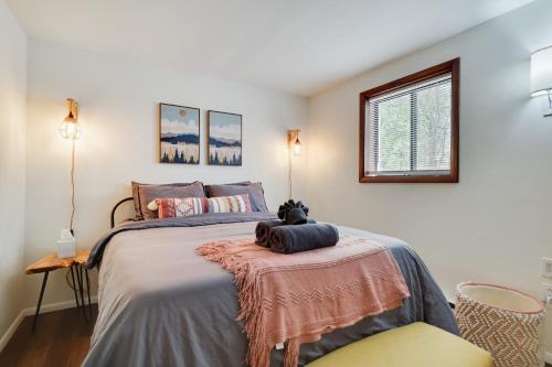 a bedroom with a bed with a teddy bear on a table at Camp Cedar:7 miles to Camelback, 5 to Kalahari! in Long Pond