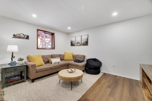 a living room with a couch and a table at Camp Cedar:7 miles to Camelback, 5 to Kalahari! in Long Pond