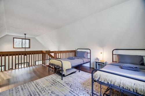 a room with two beds and a balcony at Camp Cedar:7 miles to Camelback, 5 to Kalahari! in Long Pond