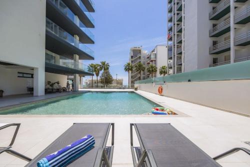Stylish Modern Beachside Apartment with Pool & Seaview