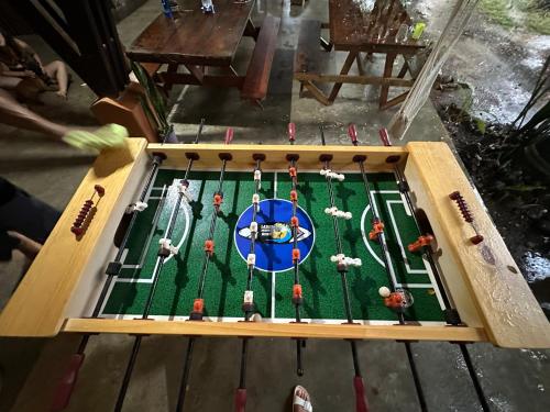 a game of golf is being played on a table at Luminosa Uvita Hostel in Uvita