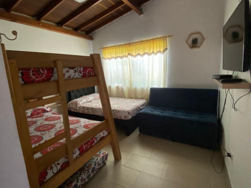 Katil atau katil-katil dalam bilik di AMPLIO APARTAMENTO AMOBLADO SECTOR LAURELES-ESTADIO Paris