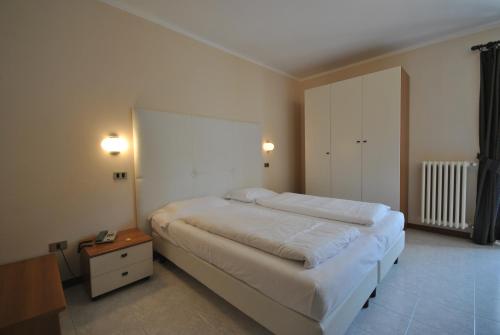 Ein Bett oder Betten in einem Zimmer der Unterkunft Hotel Gallo