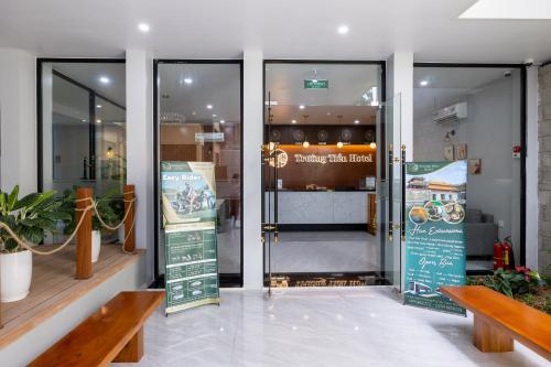 a glass door of a store with a sign in it at TRUONG TIEN HOTEL in Hue
