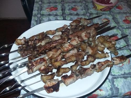 a white plate with a bunch of food on a table at Guest House Maria in Sighnaghi