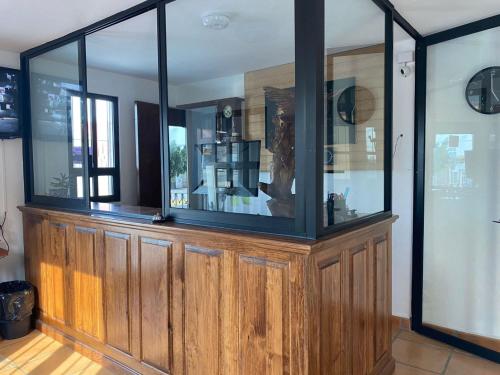 a large wooden display case in a room at Hotel La Lejona in San Miguel de Allende