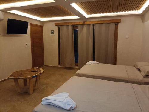 Ένα ή περισσότερα κρεβάτια σε δωμάτιο στο GEMA Aparthotel & Beach
