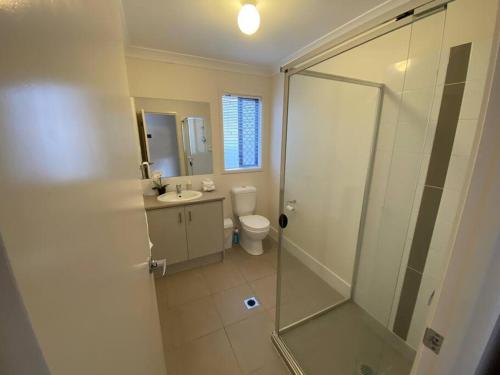 a bathroom with a shower and a toilet and a sink at The peaceful place to stay – in Gold Coast