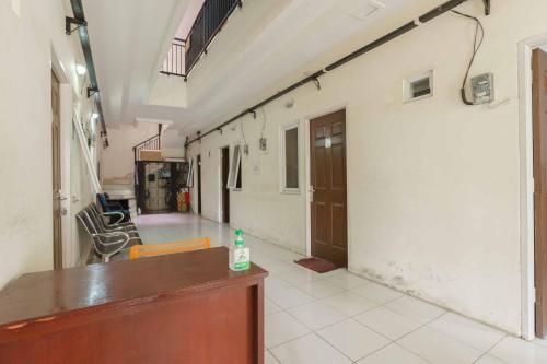 an empty hallway of a building with a room at KoolKost Syariah @ Citraland Puri Serang in Serang