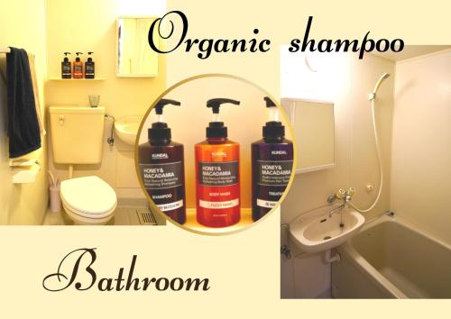 a bathroom with two bottles of shampoo and a mirror at Hotel MOANA絶景オーシャンビューカフェラウンジ in Oshima