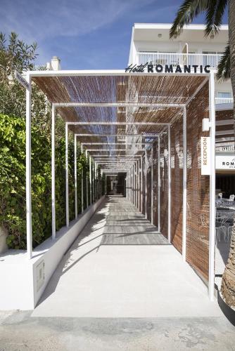 a walkway leading into a building with a brick wall at Cabot Romantic- Adults Only in Port de Pollensa