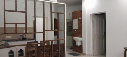 a bathroom with a staircase and a toilet in it at Royal Square Service Apartment in Thrissur Town in Trichūr