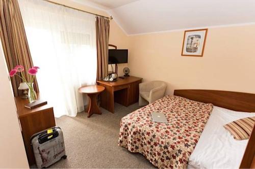 Ένα ή περισσότερα κρεβάτια σε δωμάτιο στο Hotel pod Wierzba