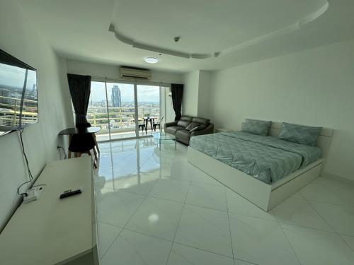 Ένα ή περισσότερα κρεβάτια σε δωμάτιο στο Condo Express View Talay 6