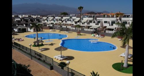 arial view of a swimming pool in a resort at Los Geranios 21 Tenerife in Costa Del Silencio