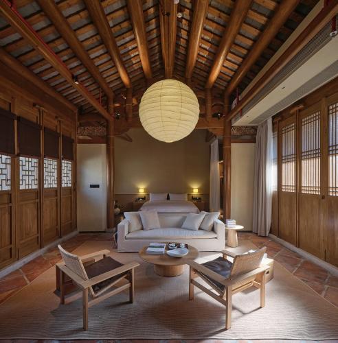 a living room with a couch and a table at Jiangnan House Chaozhou in Chaozhou