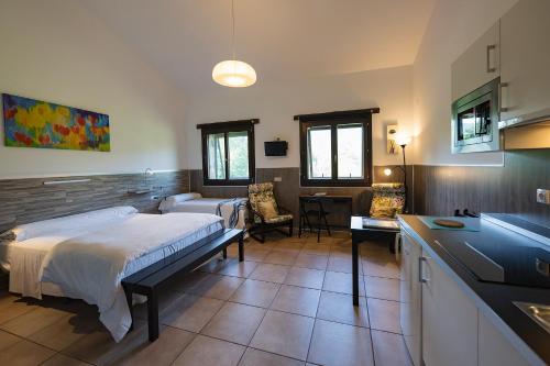 a hospital room with a bed and a kitchen at Gorosarri in Escoriaza