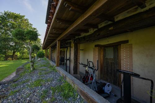 a building with two bikes parked on the side of it at Gorosarri in Escoriaza