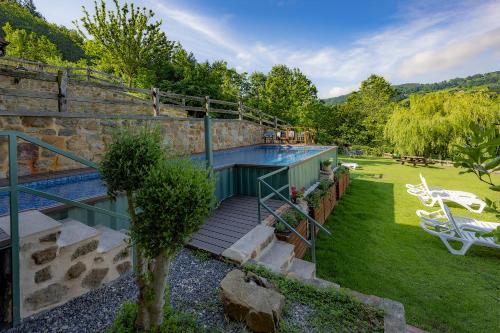 a house with a swimming pool in a yard at Gorosarri in Escoriaza
