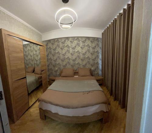 a small bedroom with a bed in a room at S-Nova in Gyumri