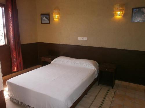 Postel nebo postele na pokoji v ubytování Auberge Amellagou